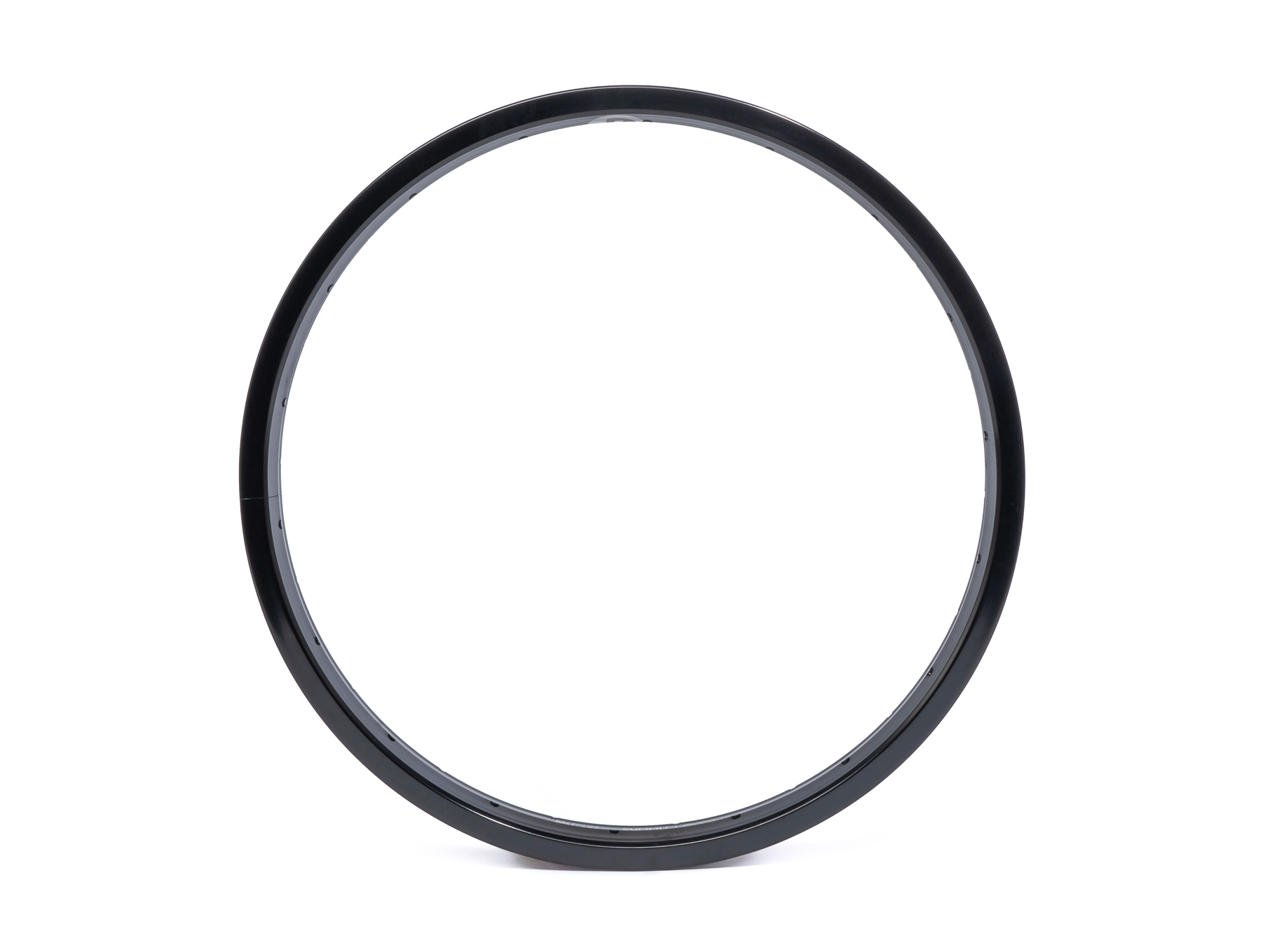 A black, circular bicycle wheel rim against a white background.