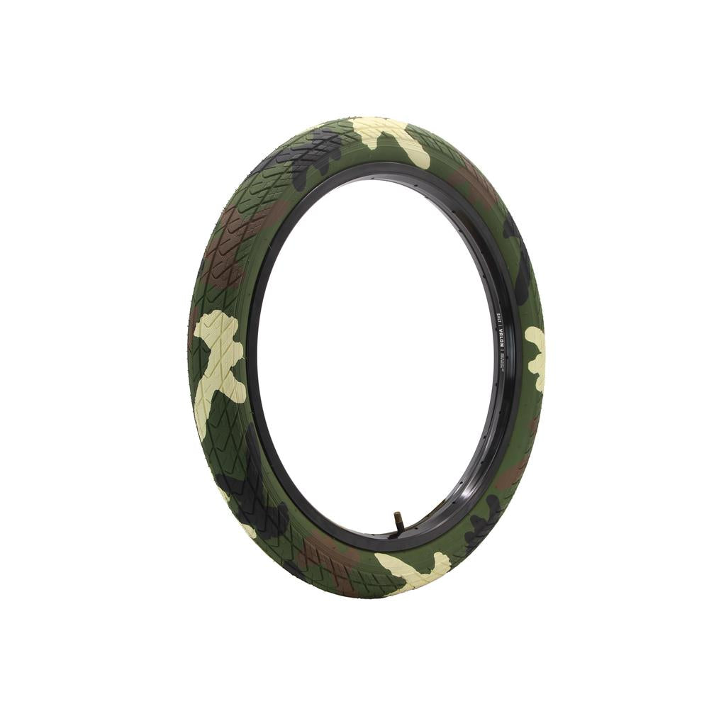 The DRS Arrow FS 20 Inch Tyre features a camouflage pattern of green, brown, and tan and is shown isolated on a white background.