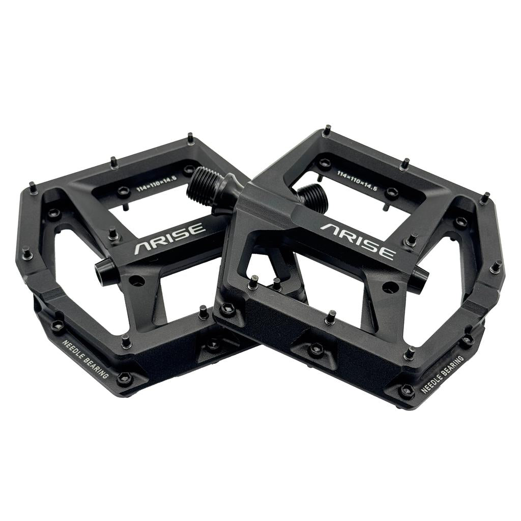 Two black Arise Helium Pro BMX race pedals feature visible pins and model markings, crafted from CNC alloy. Surface details include dimensions and a needle bearing system.