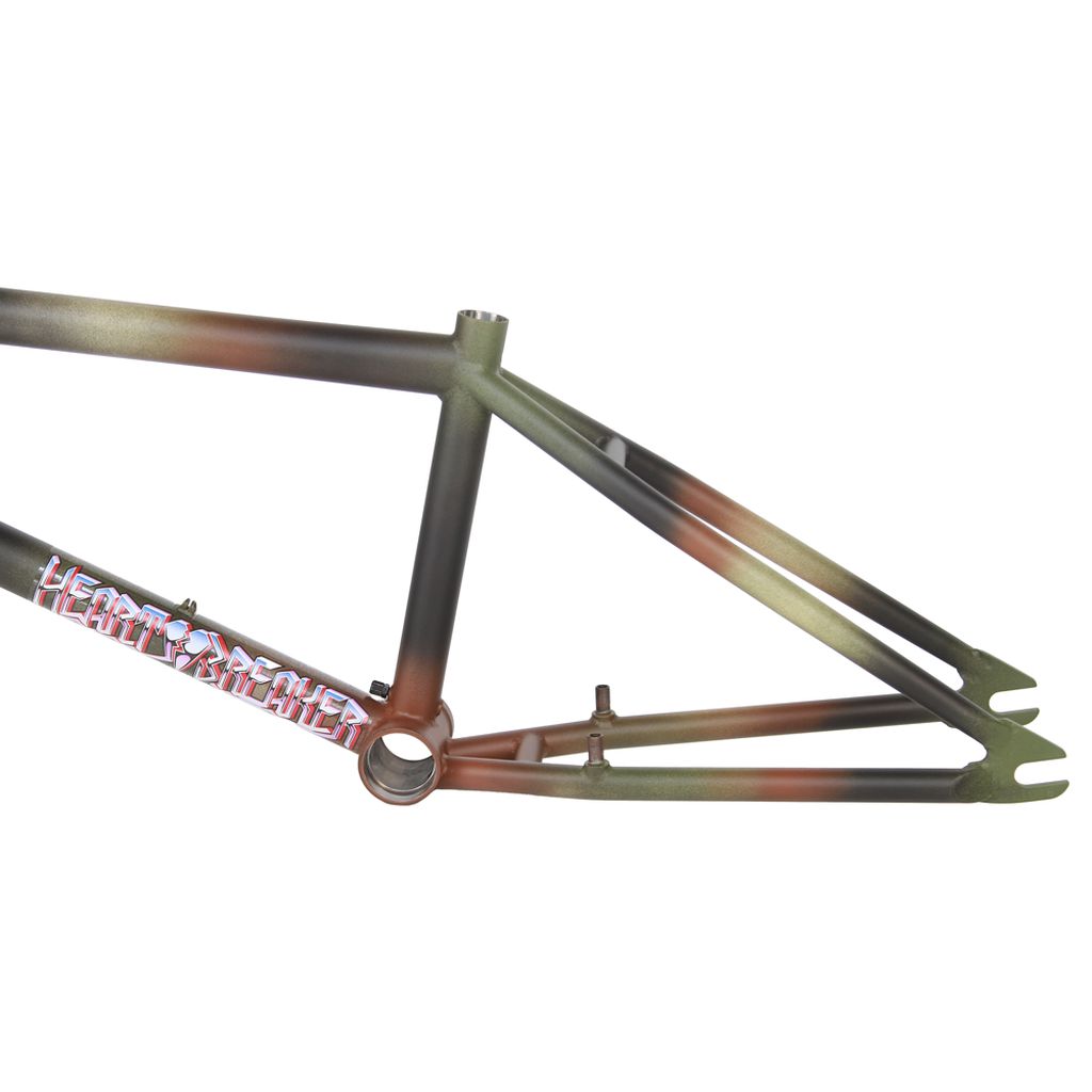 The Fit Heartbreaker Frame (Chris Harti) is a BMX frame that showcases a bold camouflage design and prominently displays "Heart Breaker" on the side, capturing the adventurous essence of Chris Harti.