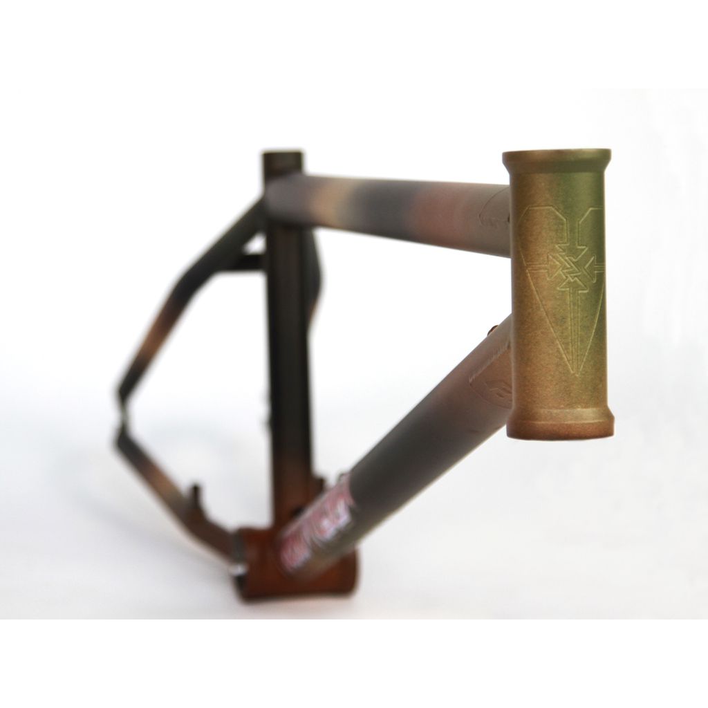 A Fit Heartbreaker BMX frame (Chris Harti model) with a metal finish, showcasing a distinctive logo on the head tube.