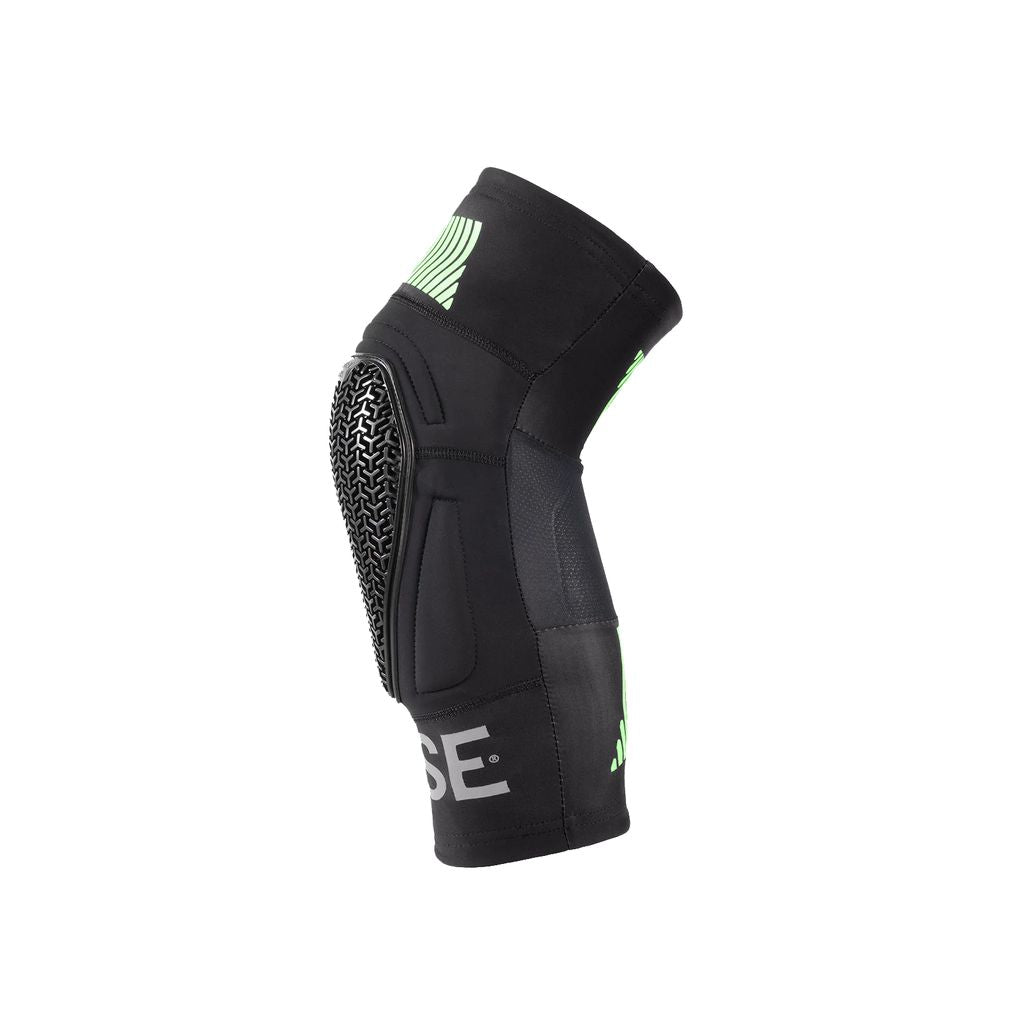 Introducing the Fuse Omega Pocket Knee Pads: a pair of travel-friendly protective gear in black with green accents and a textured front panel. These knee pads feature an ultra-lite SAS-TEC design for a snug fit, ensuring comfort and safety on every adventure.