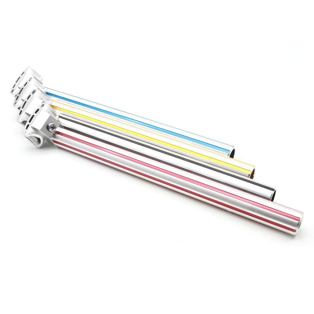 Four MCS Fluted Seat Posts, each with striped designs in blue, yellow, black, and red, stand against a white background.