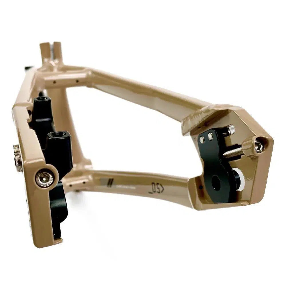 A Staystrong V5 Disc Pro XL Frame in beige aluminum with black attachments, various mount points, and a disc brake system.