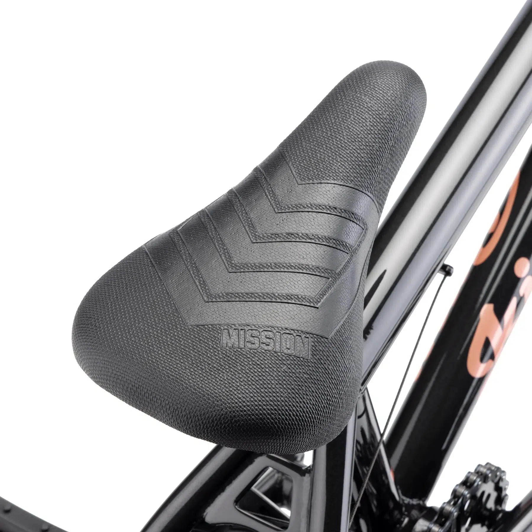 Close-up of a black bike saddle featuring the word "MISSION," mounted on a sleek black BMX bike frame from Kink Carve 16 Inch Bike by Mission parts.