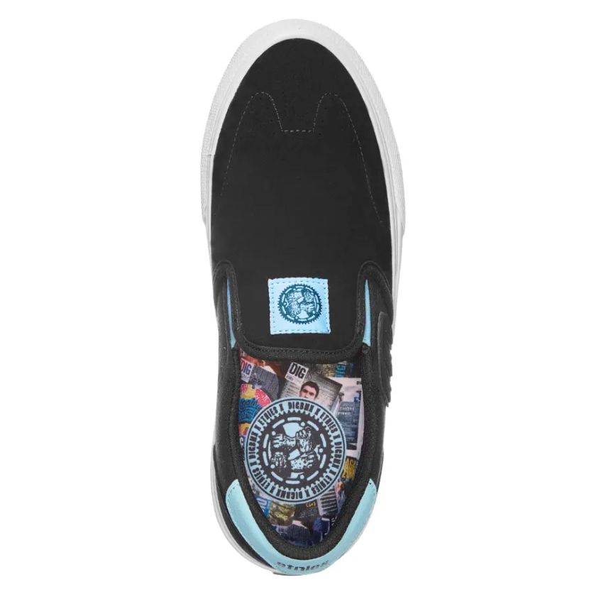 The Etnies Lo-Cut X DIG Slip on in Black/Blue features a white sole and turquoise accents, along with a printed inner lining showcasing assorted colorful graphics and a circular design on the insole.