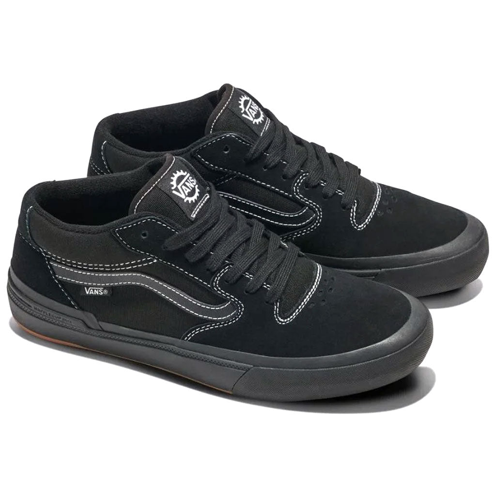 A pair of Vans BMX Style 114 Black/White sneakers features white stitching, black laces, and a logo on the tongue and side of each shoe, displayed against a white background. Known for their durability and cushioning, these shoes are perfect for BMX enthusiasts.