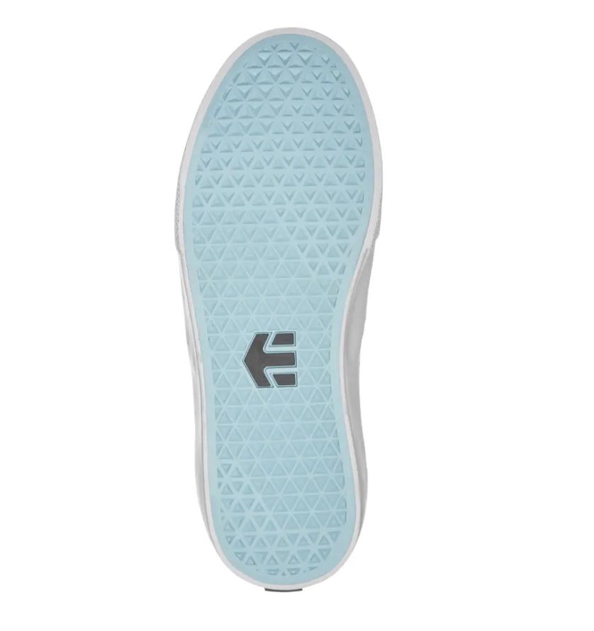 Bottom view of the Etnies Lo-Cut X DIG Slip-on in Black/Blue, showcasing a light blue rubber sole with a triangular tread pattern that's ideal for shredding, complete with a logo positioned in the center.