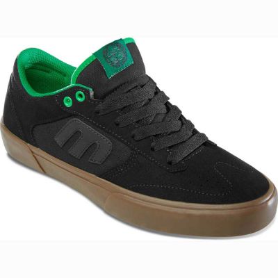 The Etnies Window Vulc X DIG in black and green showcases a prominent "E" emblem on the side, complemented by a brown rubber sole. These stylish shoes are ideal for those eager to dive into the skateboarding scene.