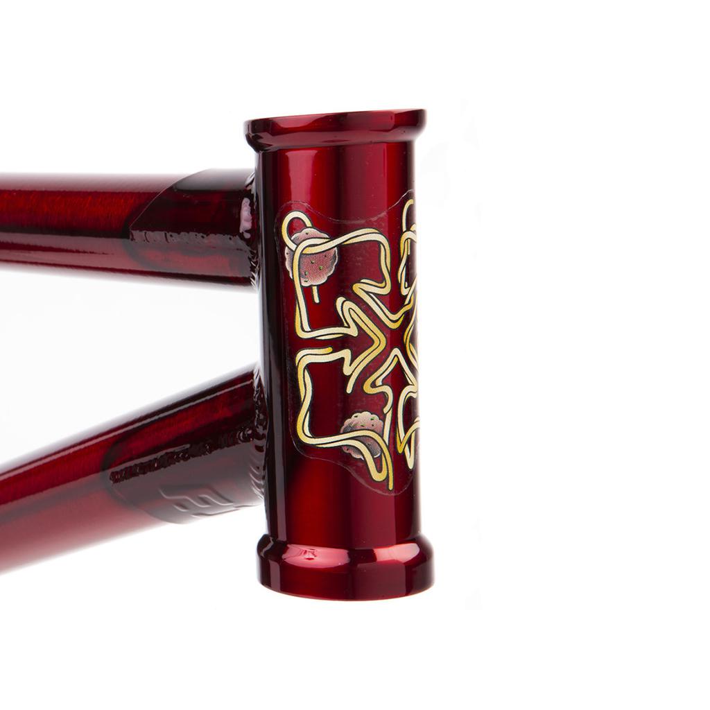 Close-up of a Fit Bike Co Sleeper (Ethan Corriere) Frame in red with gold detailing on the head tube, transforming this bike into a true street treat.