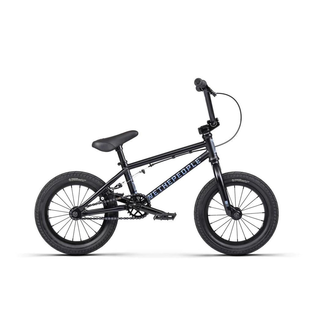 The Wethepeople Riot 14 Inch BMX Bike is a sleek black model featuring a compact frame, thick tires, and upright handlebars with the brand on the frame. Pre-order this stylish ride now!.