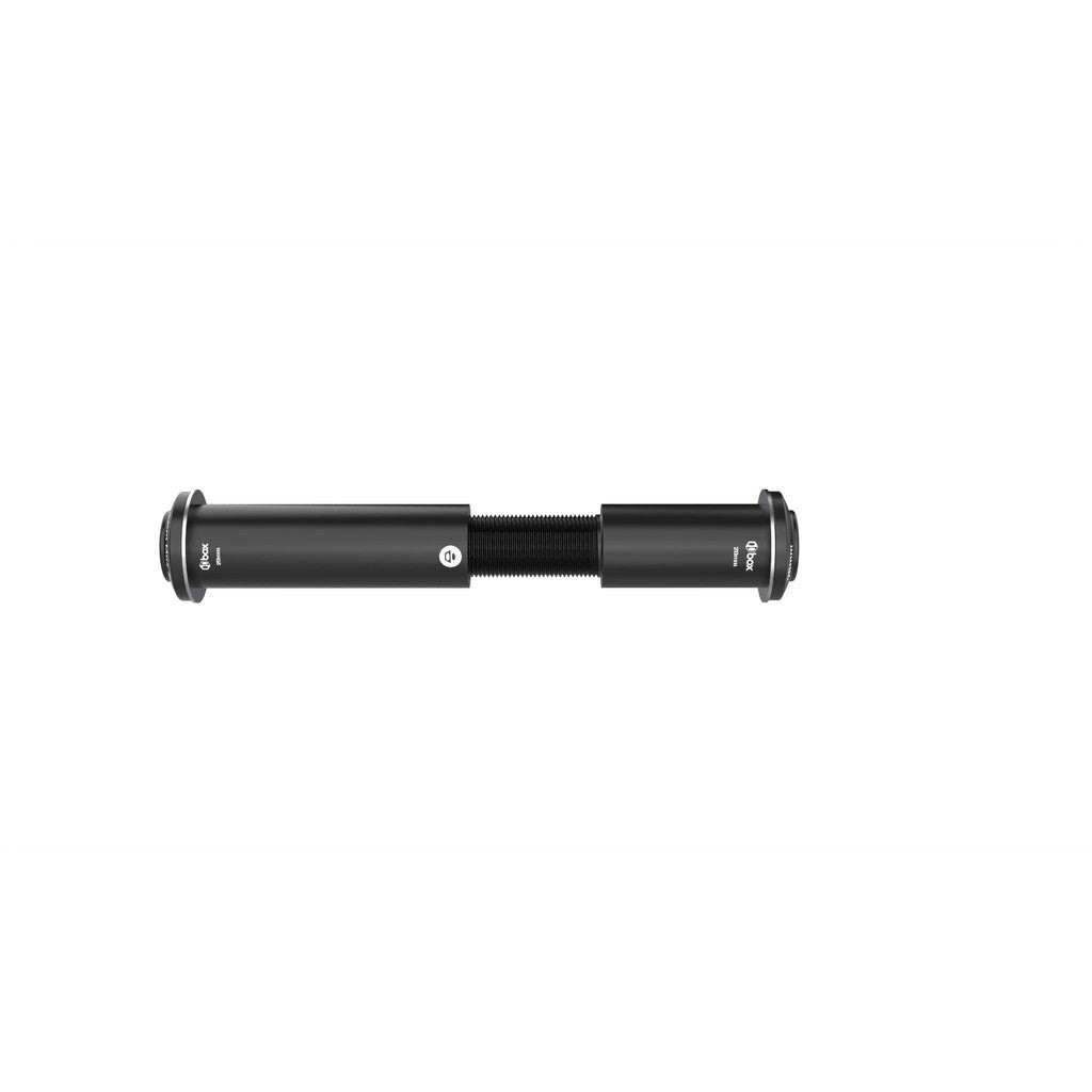 A black cylindrical mechanical component, similar to the Box One 20mm Thru-Bolt Adjustable 105mm to 130mm, has threaded sections on each end. Ideal for a BMX racing setup, it is crafted to integrate flawlessly with 20mm through hubs when aligned horizontally.