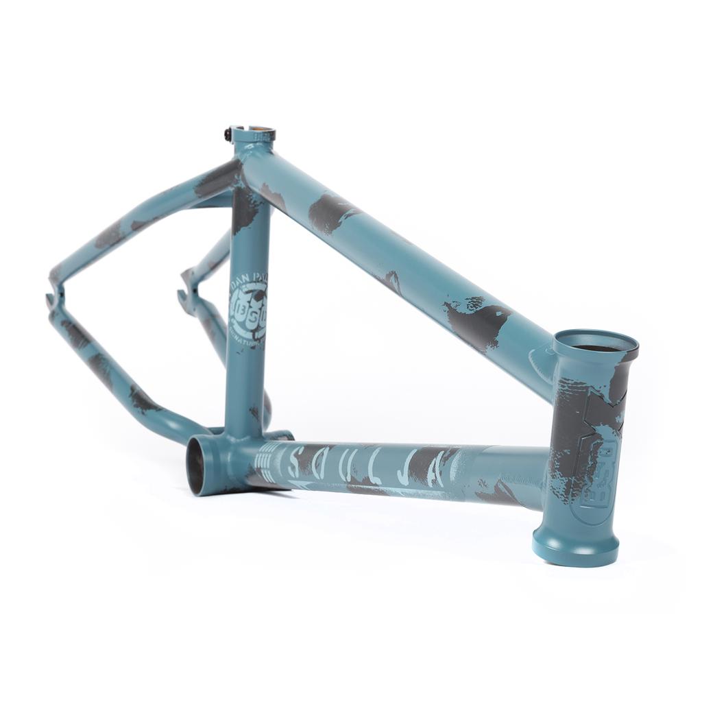 The 2021 BSD Soulja V4 Frame boasts a vibrant blue finish with dark gray accents and text on a white backdrop, enhanced by Superscoop chainstay tubing for extra durability.