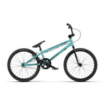 The Radio Cobalt Expert Bike is a teal BMX race bike with black handlebars, seat, and tires. Perfect for entry-level riders, its design is inspired by Radio Raceline, combining style and performance against a crisp white background.