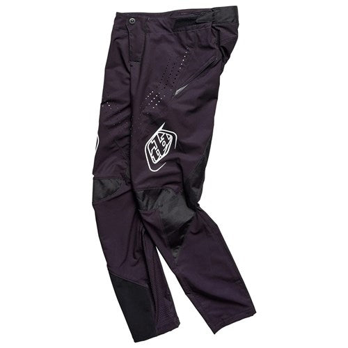 The TLD 25.1 Sprint Pant (Youth) in Mono Black is displayed flat on a white background, highlighting its sleek design with prominent logos, reinforced knees, and secure waist closures—ideal for racing enthusiasts.