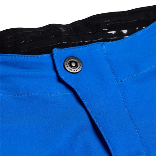 Close-up of race-ready TLD 25.1 Sprint Pant in Mono Bright Blue, featuring a black button and black interior waistband with white text. Crafted from durable materials, these pants are designed for effortless movement.