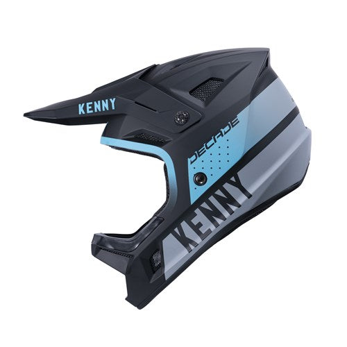 Black and turquoise full-face helmet, branded with "KENNY" and "DECADE," includes a visor, ventilation slots, and MIPS technology for enhanced safety during downhill biking adventures.