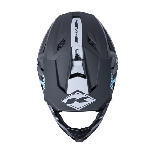 Aerial view of the Kenny Racing Decade Full Face Helmet in black and turquoise, featuring blue accents, geometric patterns, and advanced MIPS technology for enhanced safety.