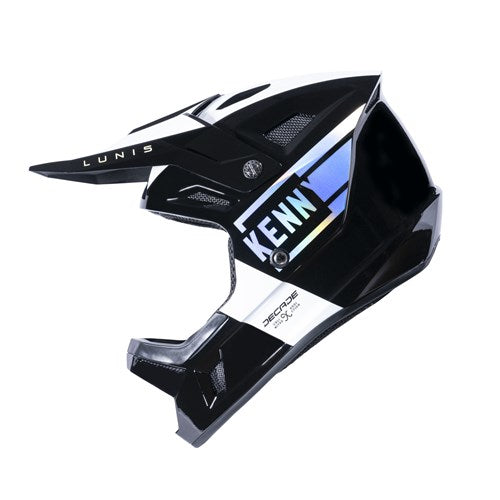 The Kenny Racing Decade Full Face Helmet in Holographic Black, shown in side profile, features "KENN" text, a visor, and an adjustable chin strap for a secure fit on BMX adventures.