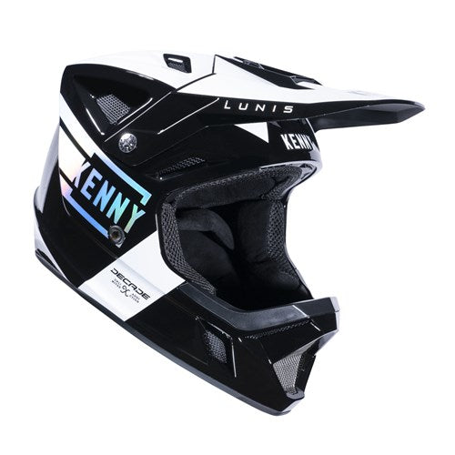 The Kenny Racing Decade Full Face Helmet in Holographic Black flaunts an angular design and glossy finish. Equipped with MIPS technology for enhanced safety, it also offers an adjustable chin strap for a tailored fit.