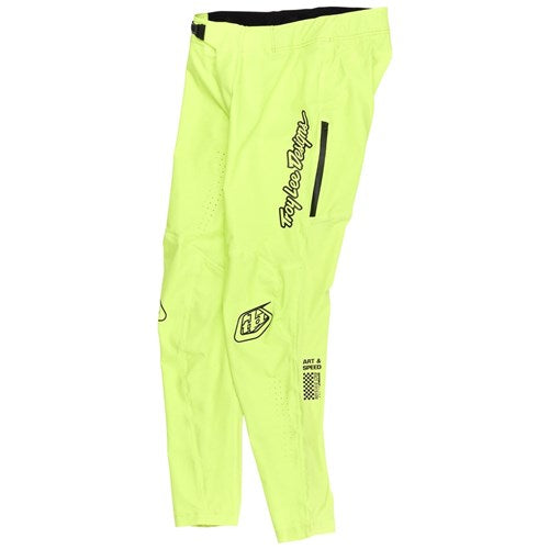 The TLD 25.1 Sprint Ultra Pant / Mono Glow Yellow, featuring black text and logos, is displayed on a white background. Made from Bluesign-approved fabric, it offers a Precision Fit for peak performance in motocross.