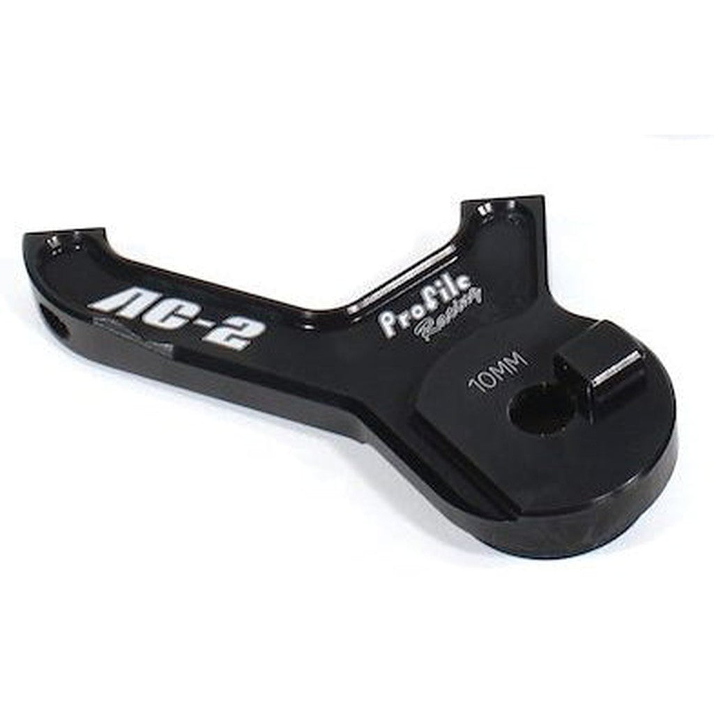 Black anodized aluminum Profile Racing AC-2 Disc Brake Adapter with "10MM" marking, designed for bike adjustments.