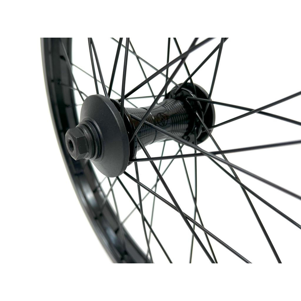 Close-up of an Alienation 18 Inch Front Wheel featuring black spokes and a BMX hub, against a white background.