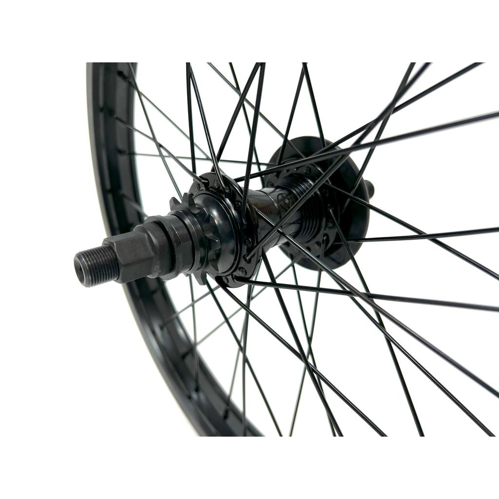 Close-up of the Alienation 18 Inch Rear Wheel, showcasing its custom design with black spokes and metal hub on a white background.