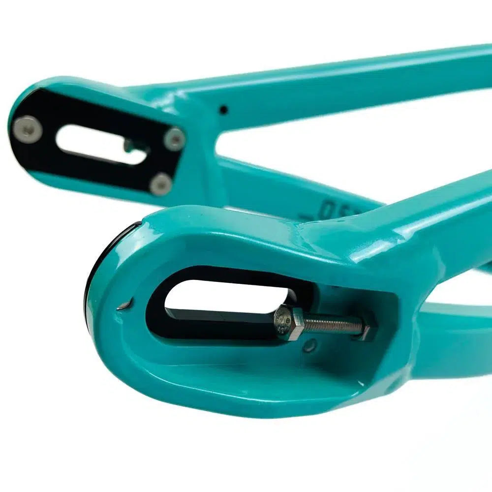 Close-up view of the rear dropouts on a turquoise Staystrong V5 Disc Junior Frame, featuring a bolt and slot design for securing the rear wheel and accommodating a disc brake.