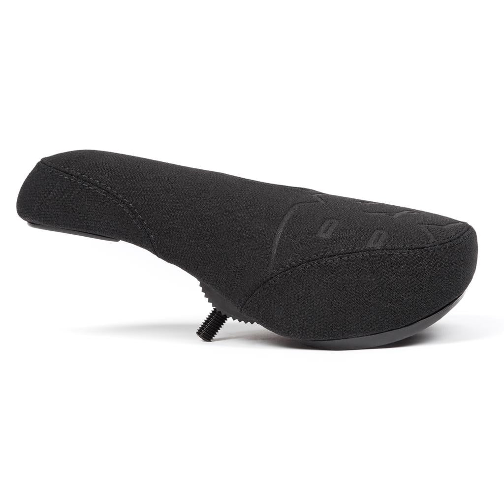 The BSD Mondo Logo Pivotal Seat is a black bicycle seat with a fabric cover, visible mounting screw underneath, and durable Kevlar construction for enhanced longevity, viewed from the side.