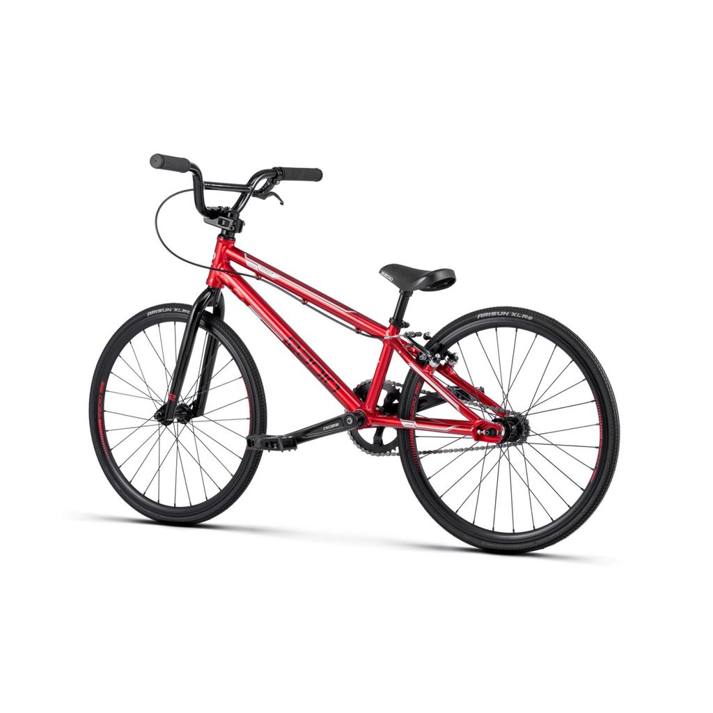 A red Radio Cobalt Junior Bike with black handlebars and tires, featuring a lightweight frame and a single gear system, perfect for those who love the thrill of racing.