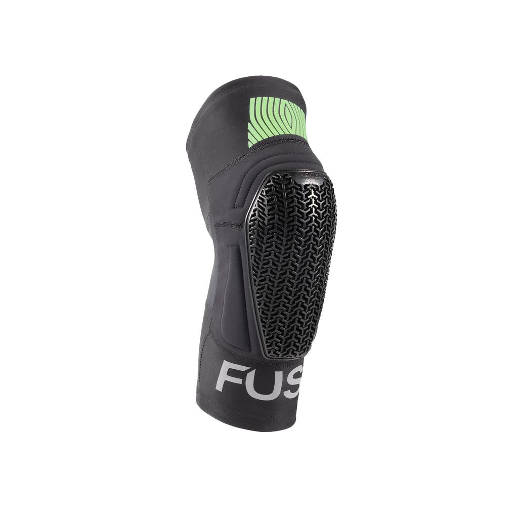 The Fuse Omega Pocket Knee Pads in black and green boast a textured protective surface and feature the word "FUSE" elegantly printed on the lower strap. Designed for travel, their ultra-lite SAS-TEC construction provides comfort and mobility for any adventure.