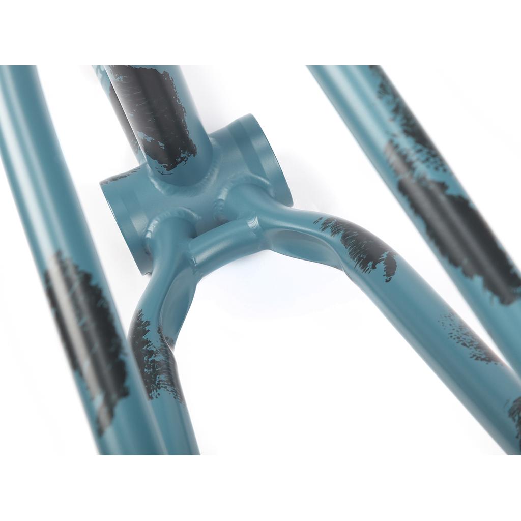 Close-up of the teal BSD Soulja V4 Frame (2021) with black paint details, showcasing the Superscoop chainstay at the connection of seat stays and chain stays to the bottom bracket shell.