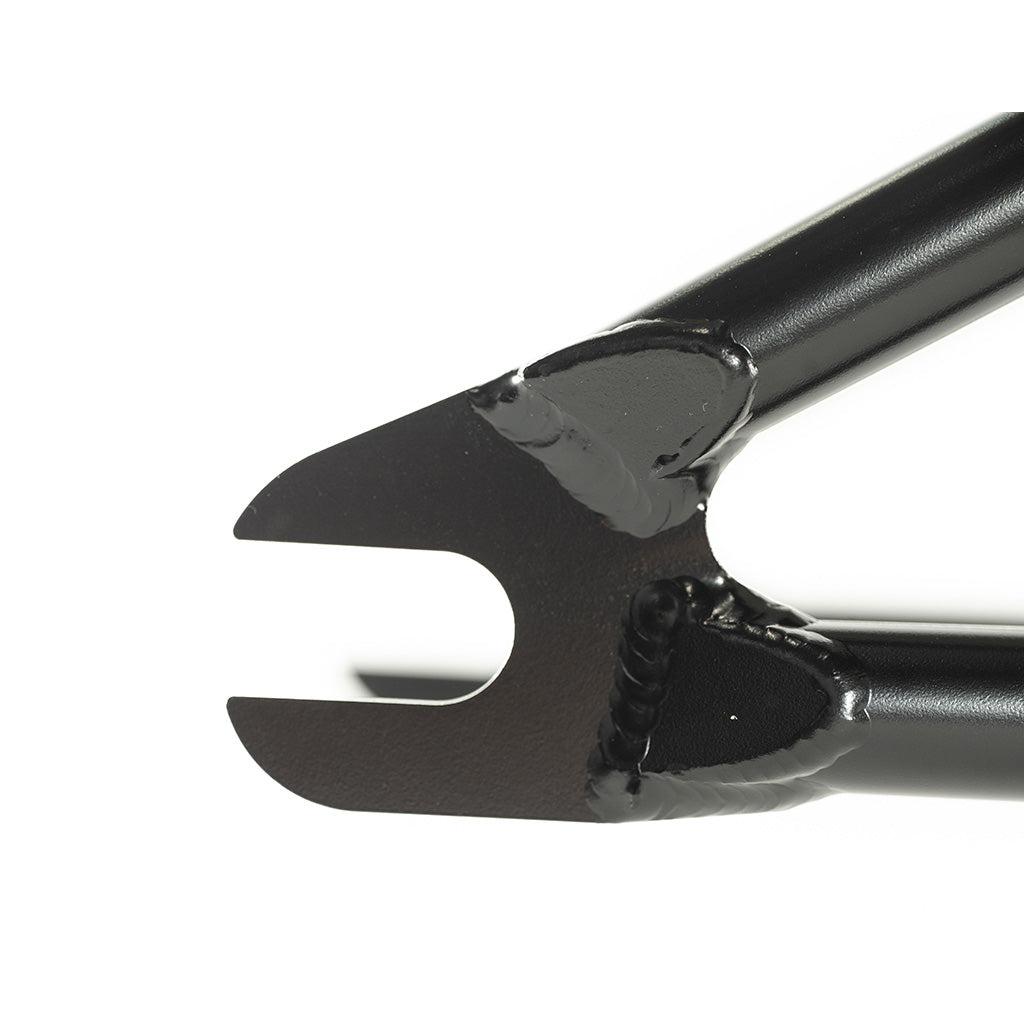 A close up of a black plastic handlebar clamp from the Colony 2024 Sweet Tooth 16 Inch Frame range.