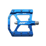 The HT AE05 Pedals (Alloy / CNC CRMO) in blue feature a CNC aluminum body with replaceable pins and a metal spindle, offering excellent grip and durability.