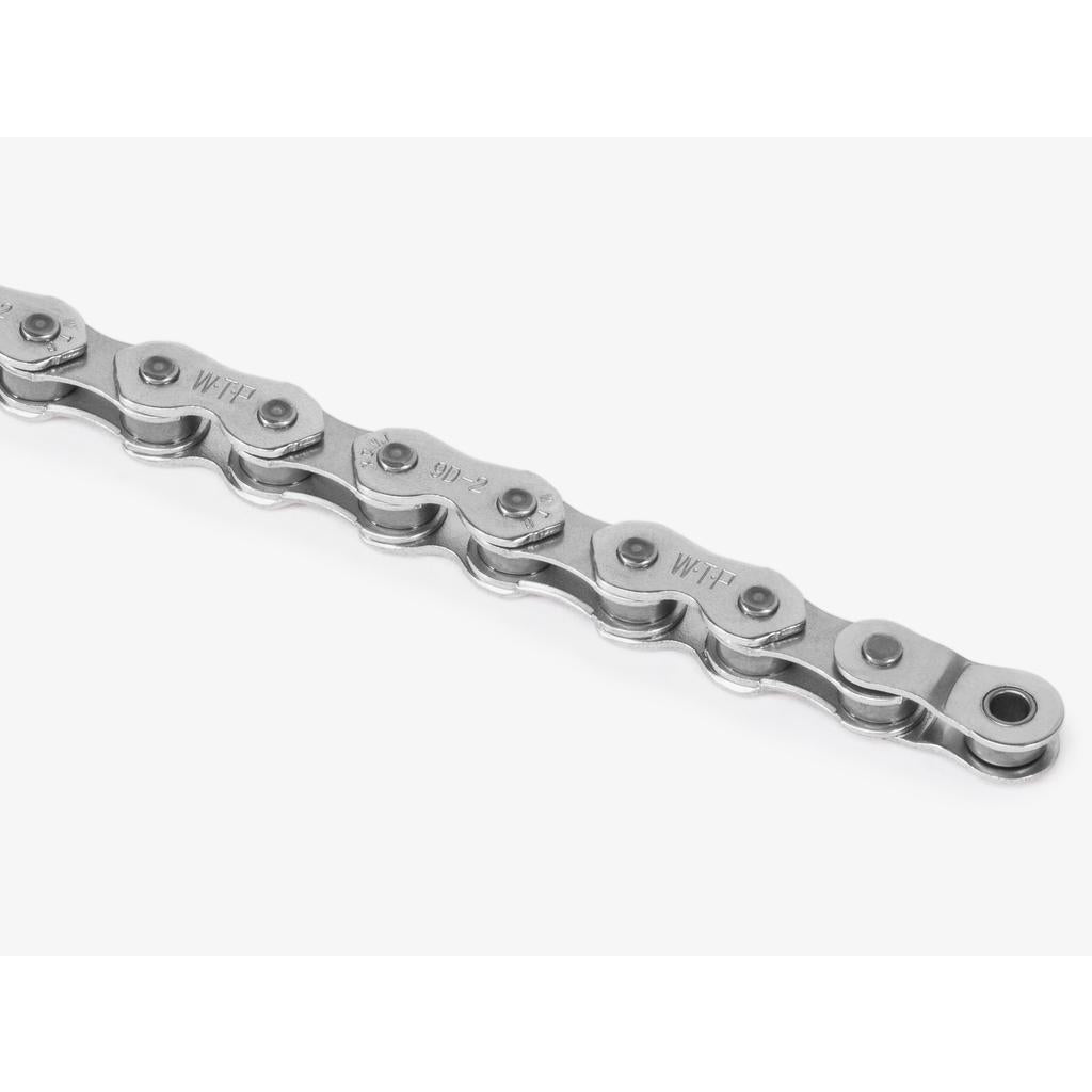 Close-up of a durable Wethepeople Demand Chain with multiple links, arranged in a straight line against a white background, showcasing top-quality craftsmanship.