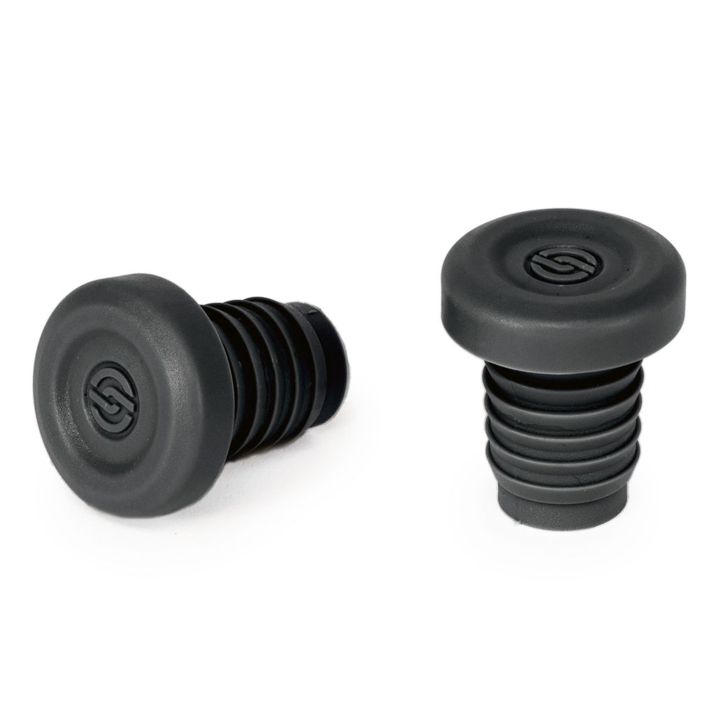 Two Salt Ex Handlebar Plugs in black are crafted from durable nylon, each featuring a ribbed neck and a round top with a small logo, displayed against a white background.