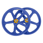 The Skyway Tuff II Rivet 20 Collectors Edition Wheelset, featuring two vibrant blue BMX wheels with striking yellow hubs and numerous spokes, positioned side by side against a plain background, evoke a sense of retro rebuilds and charm.