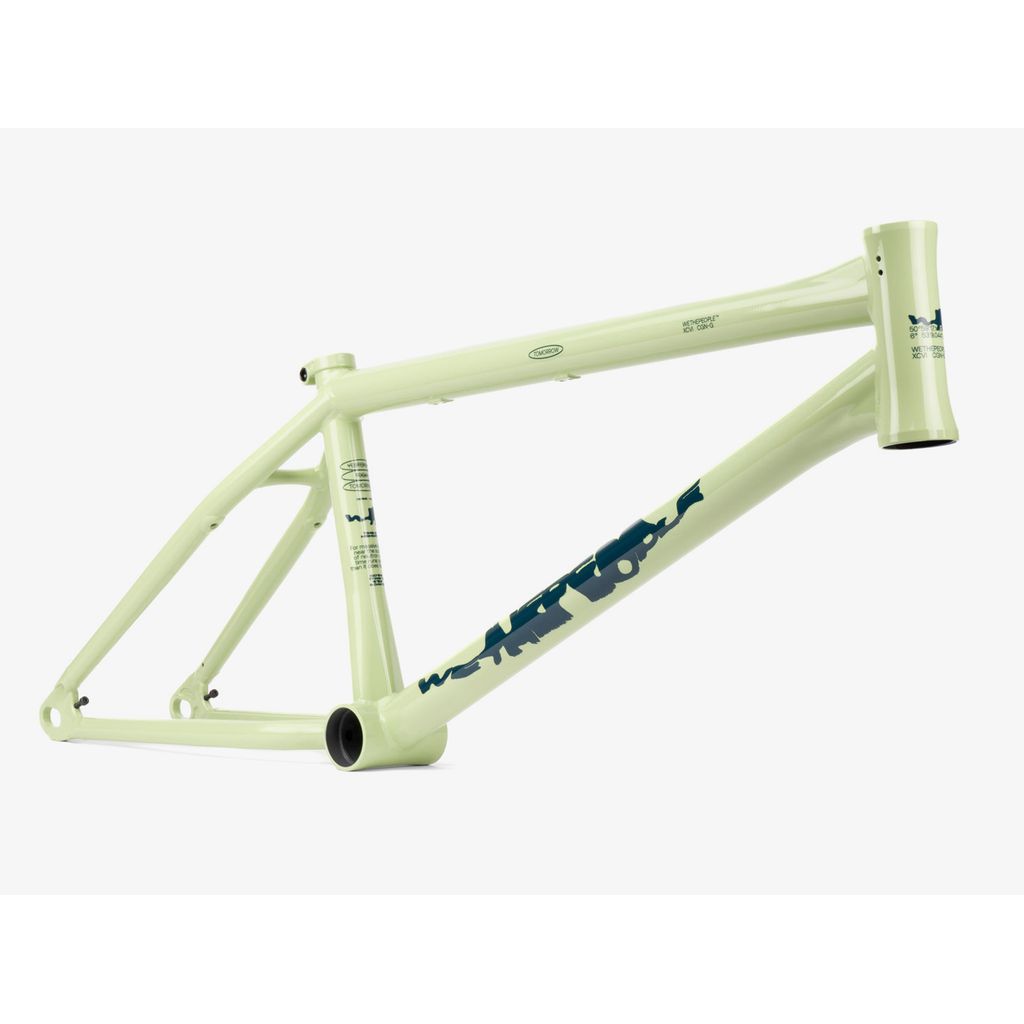 A light green Wethepeople Tomorrow Frame bicycle features blue text on the side, incorporating modern BMX design elements.