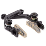 A set of black VP-565 BMX Brake calipers and transparent Odyssey Ghost pads on a white background.