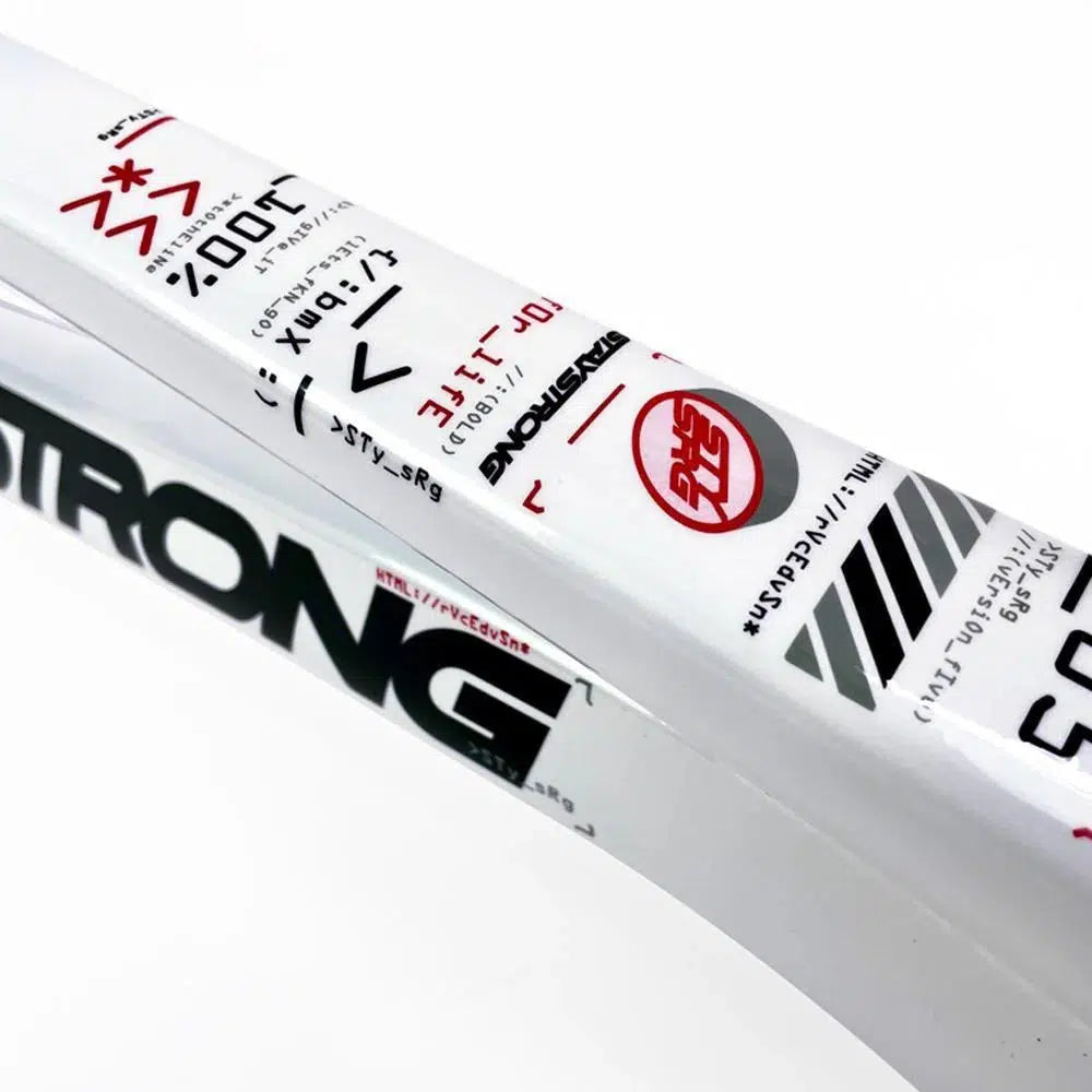 Close-up image of a white aluminium race frame with various black and red text and symbols, including the word "STRONG" prominently visible. The Staystrong V5 Disc Pro XL Frame showcases the elegance and performance synonymous with disc brake beauties.