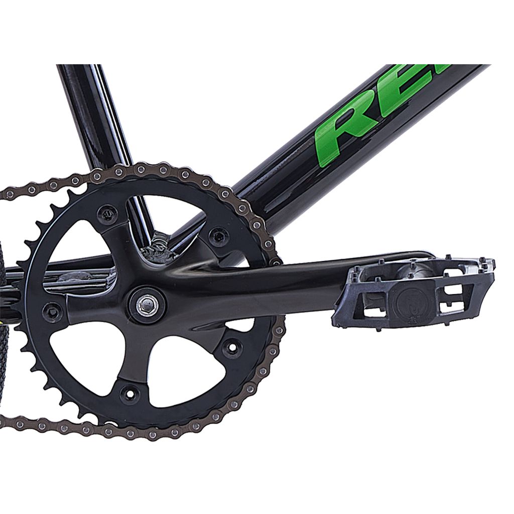 Close-up image of a Redline MX Junior Bike, showing the chain, chainring, crank arm, and pedal on an aluminum black and green frame designed for BMX racing.