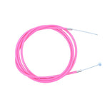 Coiled neatly on a white background, the Odyssey Linear Slic K-Shield BMX Brake Cable in pink showcases its sleek design and precision.