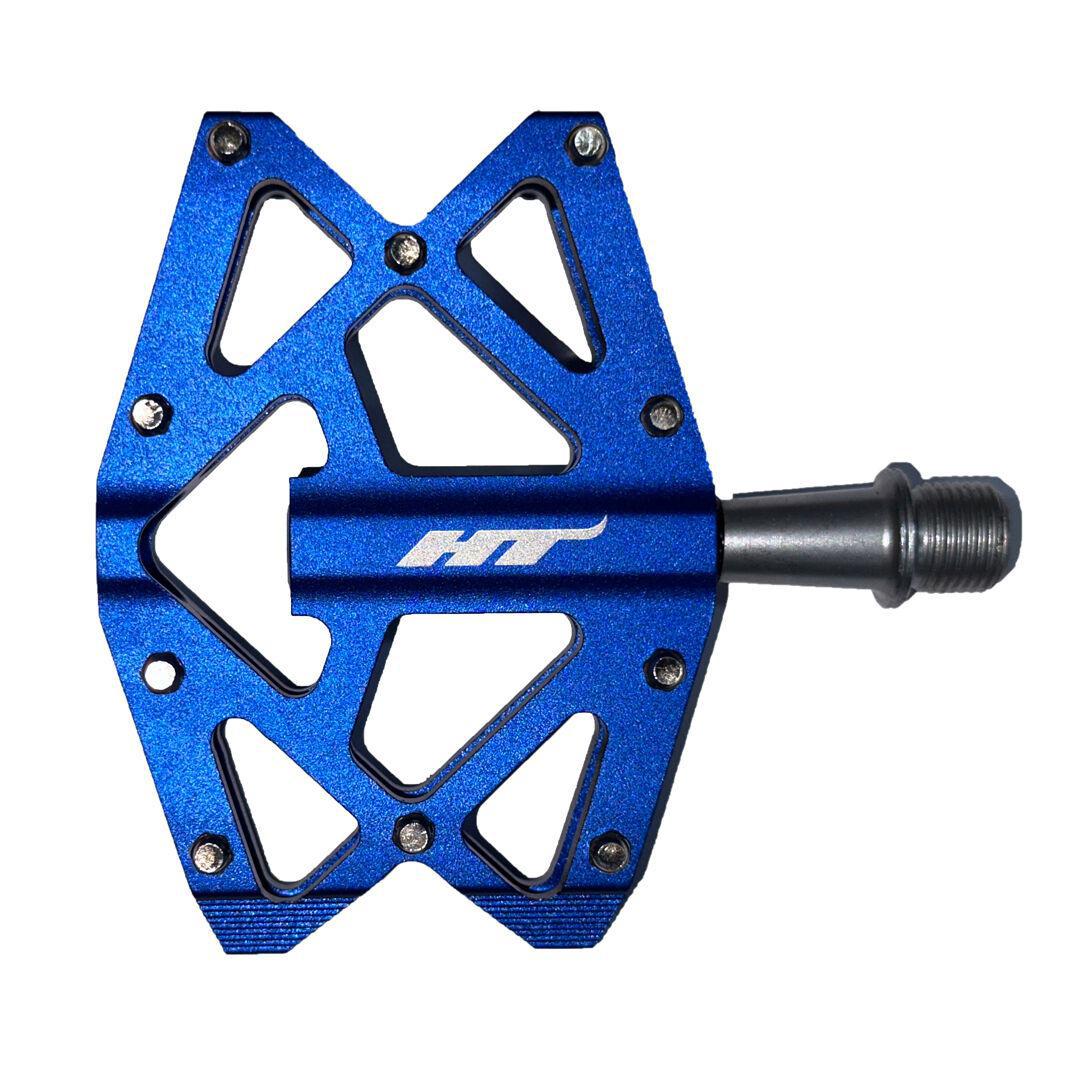 The HT AXO1A Nano Pedals are lightweight blue bicycle pedals with a geometric design and a silver axle, featuring a logo at the center. Ideal for kids' bikes, they offer smooth riding and durability.