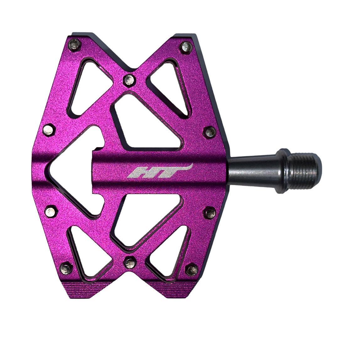 The HT AXO1A Nano Pedals are lightweight purple pedals with a silver axle and geometric cutouts.