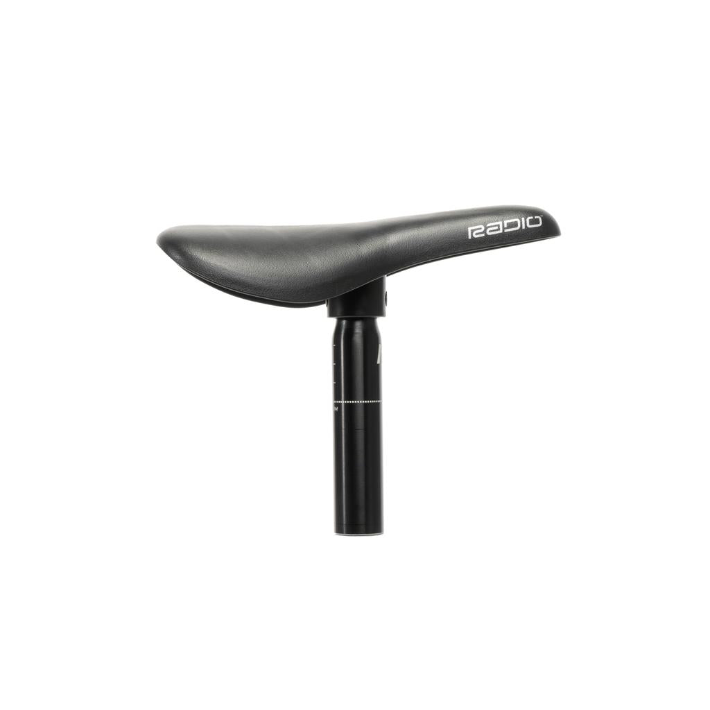 The Radio Raceline Seat & Post Combo is a black bicycle saddle with a lightweight seat post, featuring the "Radio" logo on the side. This one-piece combo is perfect for Pro frames aiming for streamlined design and performance.