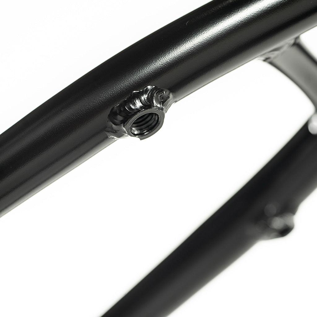 A close up of a black Colony 2024 Sweet Tooth 16 Inch bicycle frame.