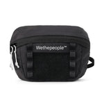 The Wethepeople Street Pack Hip Bag features a front mesh pocket, logo, adjustable strap, and two zipped compartments for practical storage on the move.