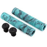 The Alienation Backlash V2 Grips are turquoise and black flangeless bicycle handlebar grips featuring black bar end plugs on a white background. Made from a proprietary formula rubber, these grips offer enhanced durability.