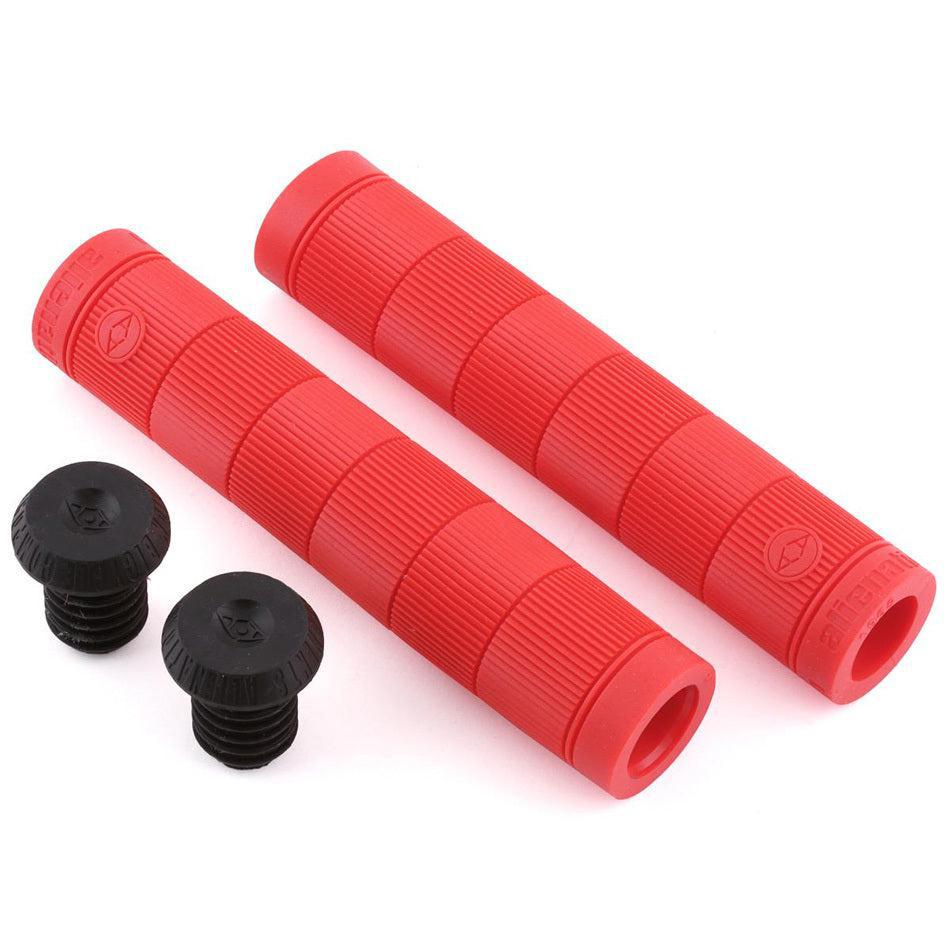 Two Alienation Backlash V2 Grips in red, crafted from proprietary formula rubber and ribbed for comfort, come with two sleek black end caps, all set against a pristine white background.